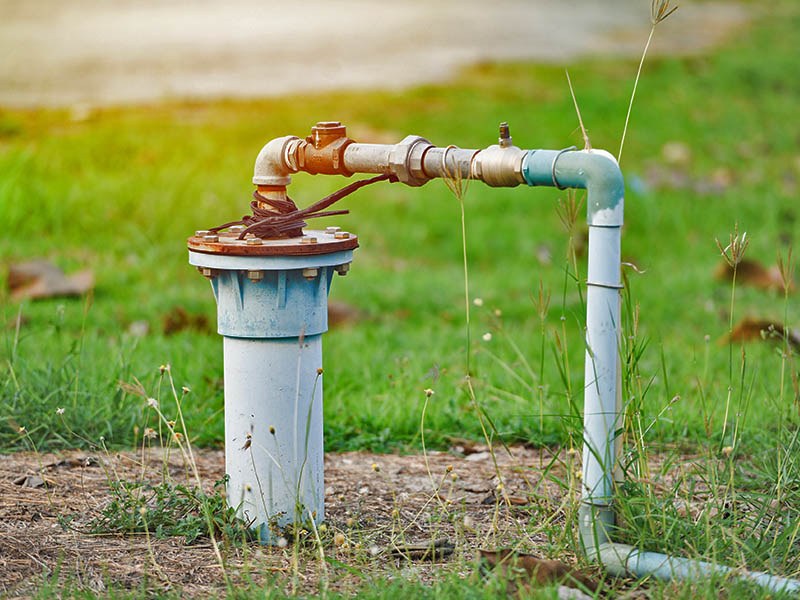 Well pipe going into groundwater well system.
